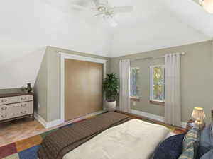 Bedroom with baseboards, vaulted ceiling, and a ceiling fan