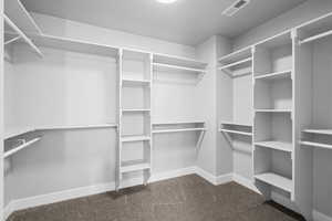 Spacious Master closet with plenty of storage space