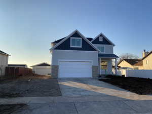 View of front of property featuring a garage