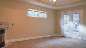 Master Bedroom with door to the rear yard Patio, crown molding, and ceiling fan.