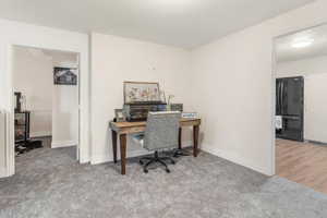 View of carpeted home office