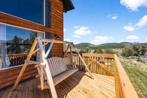 Wooden deck featuring a mountain view