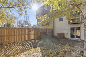 View of yard with a balcony and a patio area