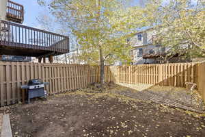 View of yard with a wooden deck