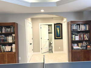 Interior space with ornamental molding and a raised ceiling