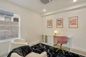 Office area featuring light hardwood / wood-style floors