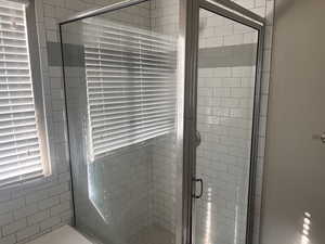 Bathroom featuring a shower with shower door