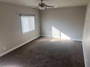 Unfurnished room with carpet, a textured ceiling, and ceiling fan