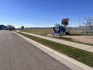 View of playground featuring a yard