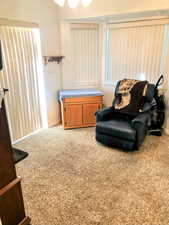 Sitting room featuring light colored carpet