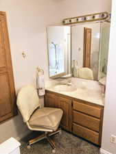 Bathroom featuring tub / shower combination and vanity