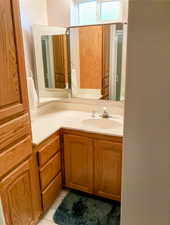 Bathroom featuring vanity and tile patterned floors