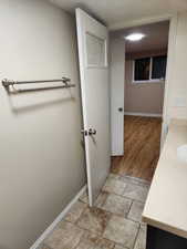 Bathroom with hardwood / wood-style floors