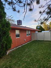 View of property exterior featuring a yard