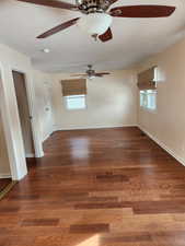 Unfurnished room with dark hardwood / wood-style flooring