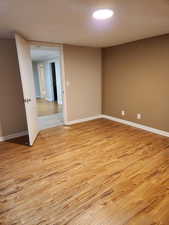 Empty room featuring light wood-type flooring