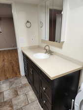 Bathroom featuring vanity and hardwood / wood-style flooring