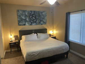 Bedroom with carpet and ceiling fan