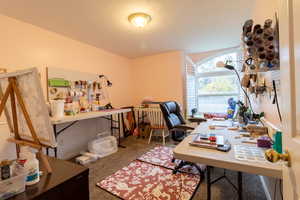 View of carpeted home office/bedroom