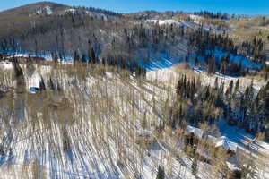 Snowy aerial view with a mountain view