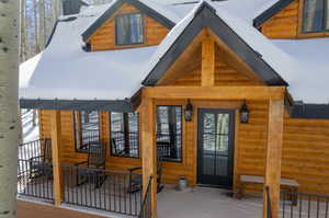 View of snow covered property entrance