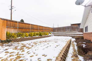 View of yard covered in snow