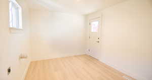 Spare room with light hardwood / wood-style flooring