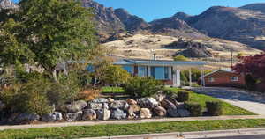 View of front of home with a mountain view