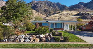 View of front of property with a mountain view