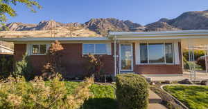 View of front of property with a mountain view