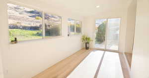 Sunroom / solarium with vaulted ceiling