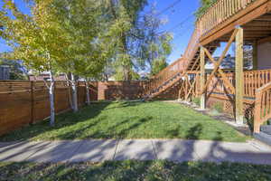 View of yard featuring a wooden deck