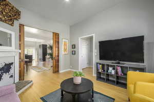 Living room with hardwood / wood-style flooring