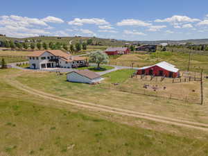 Aerial view featuring a rural view and a mountain view