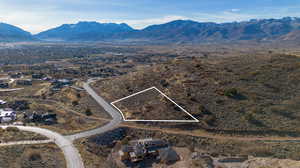 Birds eye view of property with a mountain view