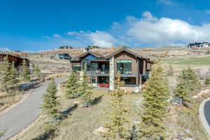 Rear view of property with a balcony