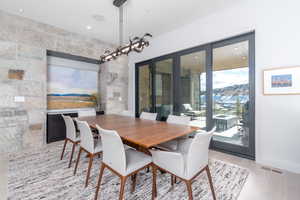 Dining space with french doors and light hardwood / wood-style floors