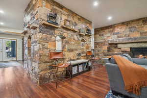 Family room on lower level with wood burning fire place, 9' ceilings and LVT flooring.