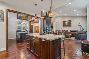 View from kitchen with prep kitchen on the left and family room on the right.