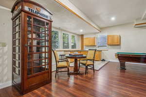 Lower level walkout with partial kitchen, LVT flooring, plantation shutters, beautiful stone work.