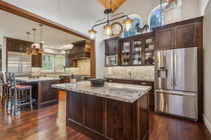 Expansive prep kitchen with additional fridge, coffee/espresso machine, warming drawer and microwave.