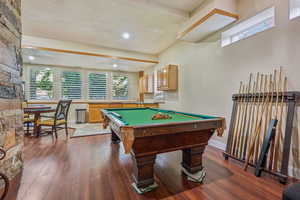 Lower level walkout with space for game tables, LVT flooring, plantation shutters, beautiful stone work.