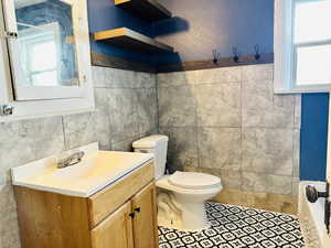 Bathroom with vanity and toilet