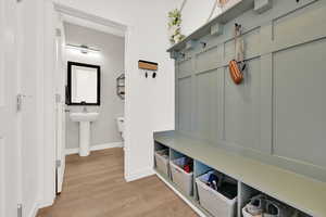 Mudroom featuring light hardwood / wood-style floors and sink