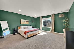 Carpeted bedroom with a textured ceiling