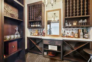 Wine room featuring a notable chandelier