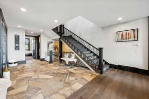 Stairs with hardwood / wood-style flooring