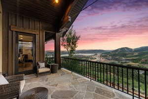 Balcony at dusk with a mountain view