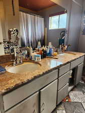 Bathroom with tile patterned flooring and vanity