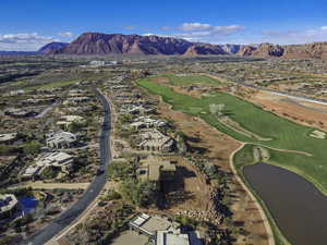 Birds eye view of property featuring a water and mountain view